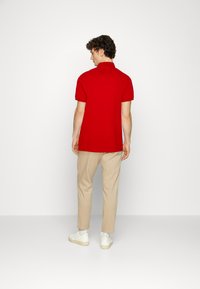 Tommy Hilfiger REGULAR - Polo - empire flame