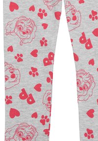 Leggings grigi con un motivo di facce di cani dei cartoni animati rosa, impronte di zampe e cuori, realizzati in un tessuto morbido con una vestibilità comoda.