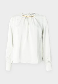 Hvid langærmet bluse med rynket halsudskæring og detaljer i guldfarve. Glat stof, afslappet pasform og ærmer med manchetter.