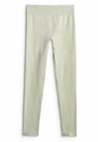 Leggings tricotés sans couture vert clair avec une large ceinture et des jambes étroites effilées, posés à plat sur un fond blanc.