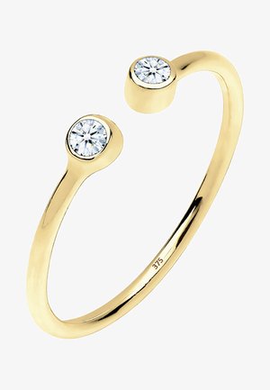 Gul cuff ring med to runde klare sten i hver ende, glat overflade, poleret finish og gravering med "375" for guldrenhed.