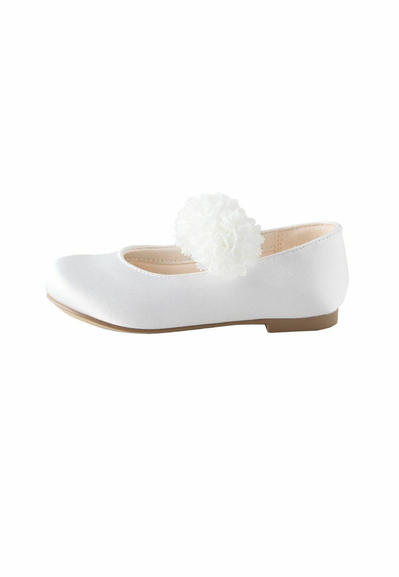 White ballet flat shoe made of satin, featuring a round toe and a textured white floral accent on the side. Flat rubber sole.