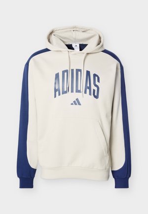 Beige and navy hoodie with Adidas logo and text on front, featuring a front pouch pocket and drawstring hood.