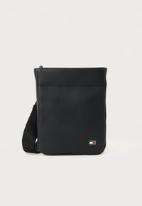 Black synthetic crossbody bag featuring a textured ribbed design, rectangular shape, adjustable strap, and branded logo detail on the front.