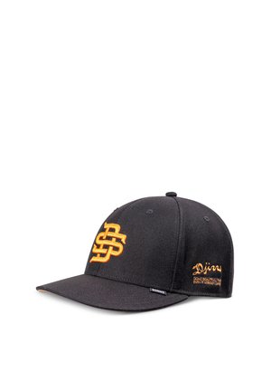 Black baseball cap with orange "DS" logo embroidered on front and "Djinns" text on side, featuring a flat brim and fabric tag.