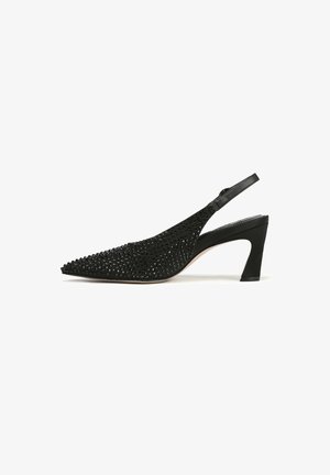 Black slingback heeled shoe with a pointed toe, featuring a textured surface adorned with small black embellishments. Leather strap and block heel.