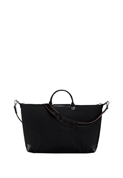 Schwarze Textiltasche mit Lederakzenten, ausgestattet mit kurzen Griffen und einem abnehmbaren Schultergurt. Glatte Textur und minimales Design.