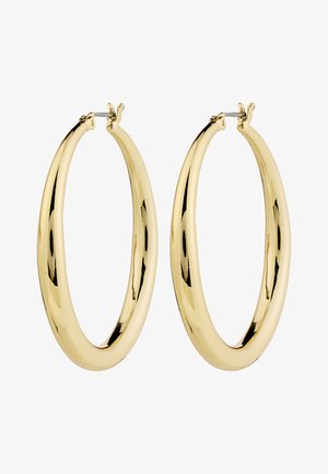 Kuldsete rõngassõrmuste sujuv, poleeritud pind. Ümmargune kuju, millel on ülaosas kindel sulgemismehhanism. Pind peegeldab valgust.