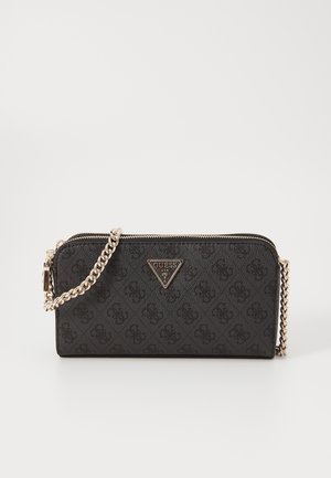 Black Guess crossbody wallet with gold chain strap, zip closure, and subtle patterned logo design.