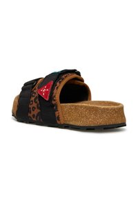 Black and brown leopard print slide sandal with a cork sole, featuring colorful fabric straps and a red triangular accent detail.