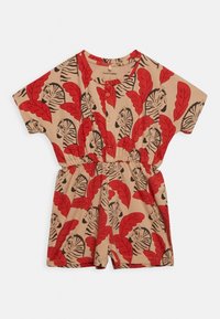 Mini kombinezon w beżowym materiale z odważnym nadrukiem czerwonych liści i twarzy tygrysa. Krótkie rękawy i elastyczna talia; zapięcie na guzik przy szyi.
