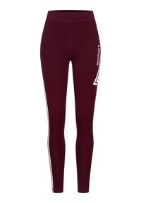 Burgunderfarbene Leggings aus dehnbarem Stoff mit hohem Bund, featuring weißer Seitenstreifen und "LONDON" auf der Vorderseite gedruckt.