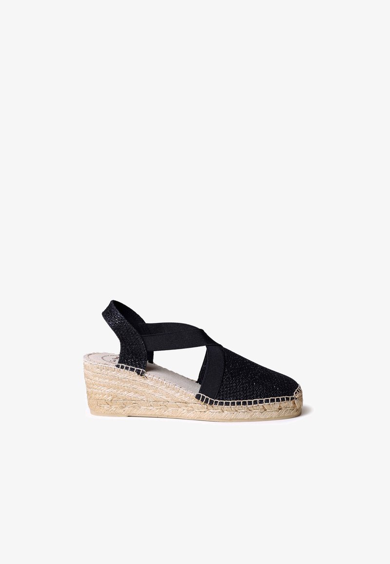 Mustad musta espadrille platsandi risti-riba disainiga, tekstureeritud kangast pealmine osa, kootud jute välispõhi ja mõõduka tallakõrgusega.
