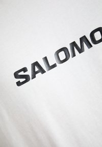 Salomon LOGO TEE UNISEX - T-shirt estampada - white