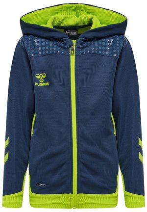 Granatowa bluza z kapturem na zamek błyskawiczny z neonowo zielonym wnętrzem, mankietami i zamkiem, z kropkowanym wzorem na ramionach oraz logo pszczoły Hummel na piersi.