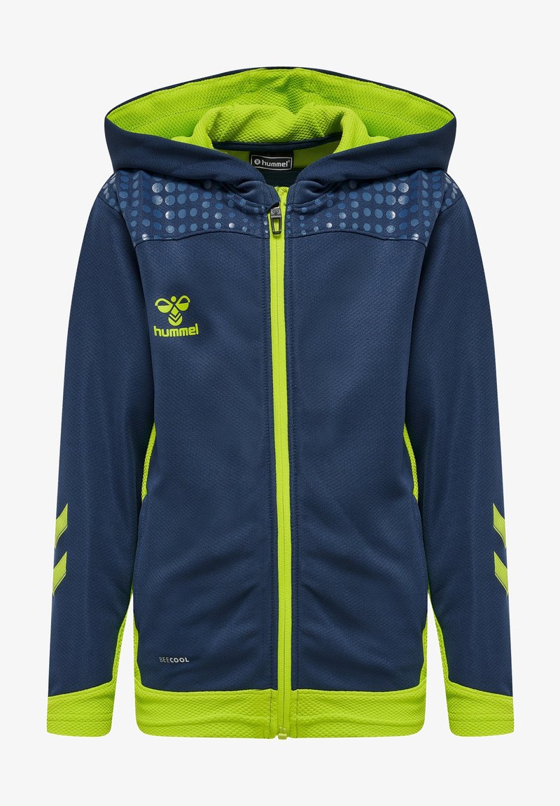 Sweat à capuche bleu marine zippé avec intérieur, poignets et fermeture éclair vert néon, présentant un motif de points sur les épaules et le logo de l'abeille Hummel sur la poitrine.