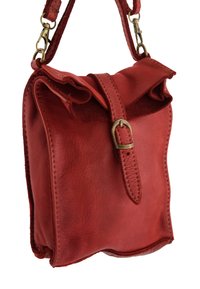 Red leather crossbody bag with a textured finish, fold-over flap, and strap featuring brass hardware accents. Compact and structured design.