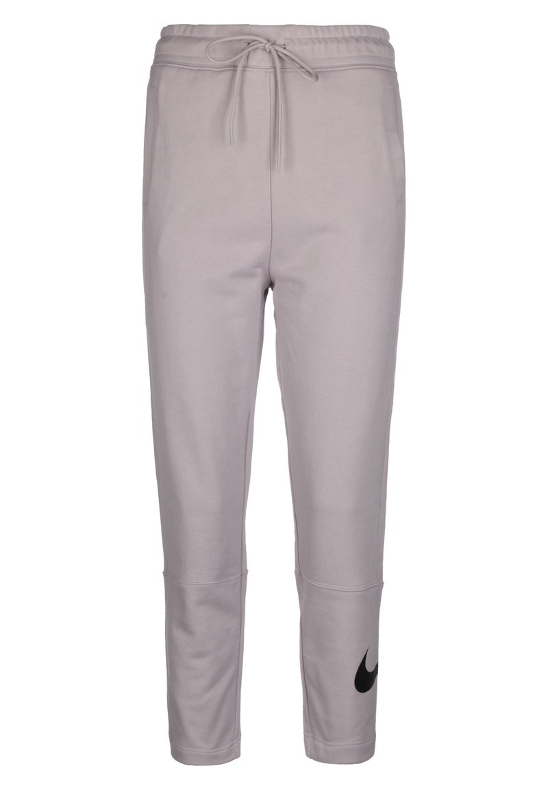 Pantalons de sudation gris clair en tissu doux, avec une taille à cordon, des jambes fuselées et un logo Nike noir sur le côté gauche.