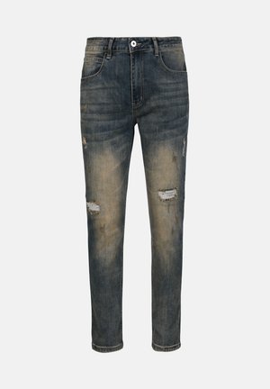 Denim jeans feature a faded blue color, slim fit, distressed details with visible rips, five-pocket design, and a button closure.