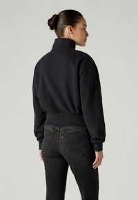 Levi's® GRAPHIC SARA 1/4 ZIP - Melegítőfelső - black