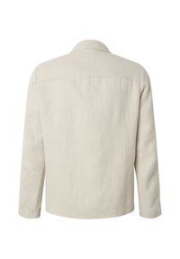 Veste en velours côtelé beige à manches longues et coupe droite, vue de dos sur fond blanc.