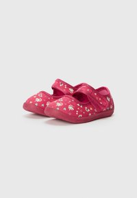Pink children's shoes with a soft fabric upper, featuring a strap closure and a patterned design of hearts and rainbows. Rubber sole.