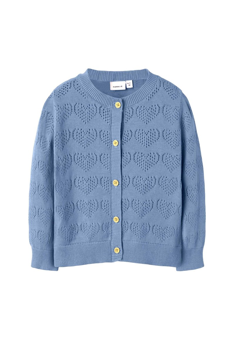 Sinine kootud kardigan südamekujude mustriga, kollaste nööpidega ees ning soonikkoes varrukaotsad ja alumine äär.
