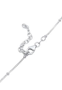 Silver chain bracelet with a lobster clasp, featuring small links and an adjustable length chain for a secure fit. Smooth, polished finish.