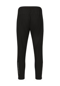 Pantalons de sport noirs avec une taille élastique, jambes fuselées et zippers aux chevilles. Logo "ENDURANCE" imprimé en argent sur le côté.
