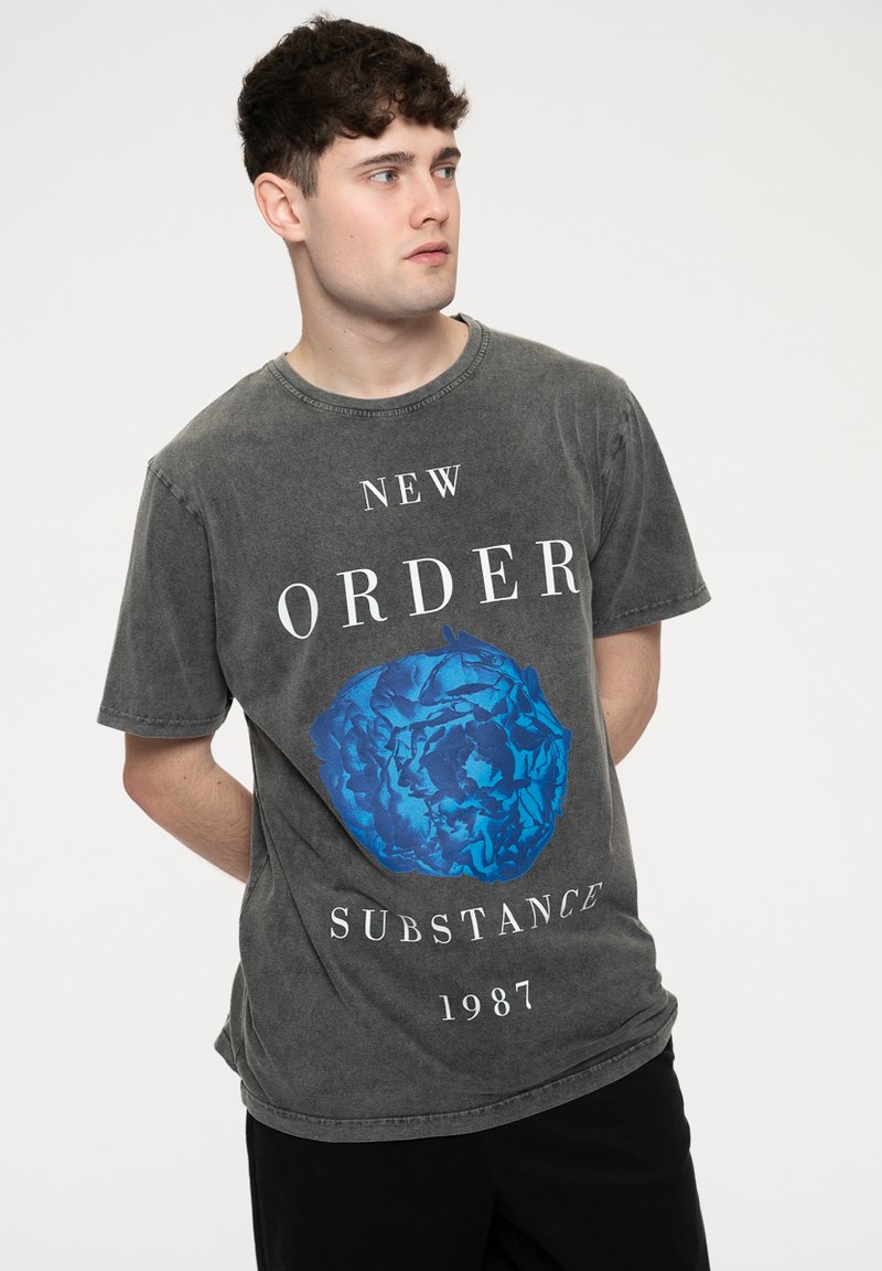 Gray cotton t-shirt with a round neckline, featuring a blue graphic design of a rose and text reading “NEW ORDER SUBSTANCE 1987.”