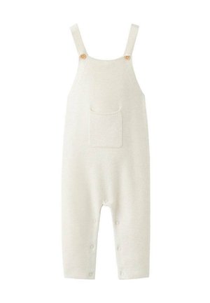 Combinaison beige tricotée avec bretelles larges, boutons en bois, une poche frontale et des fermetures à boutons aux jambes pour faciliter l'habillage.