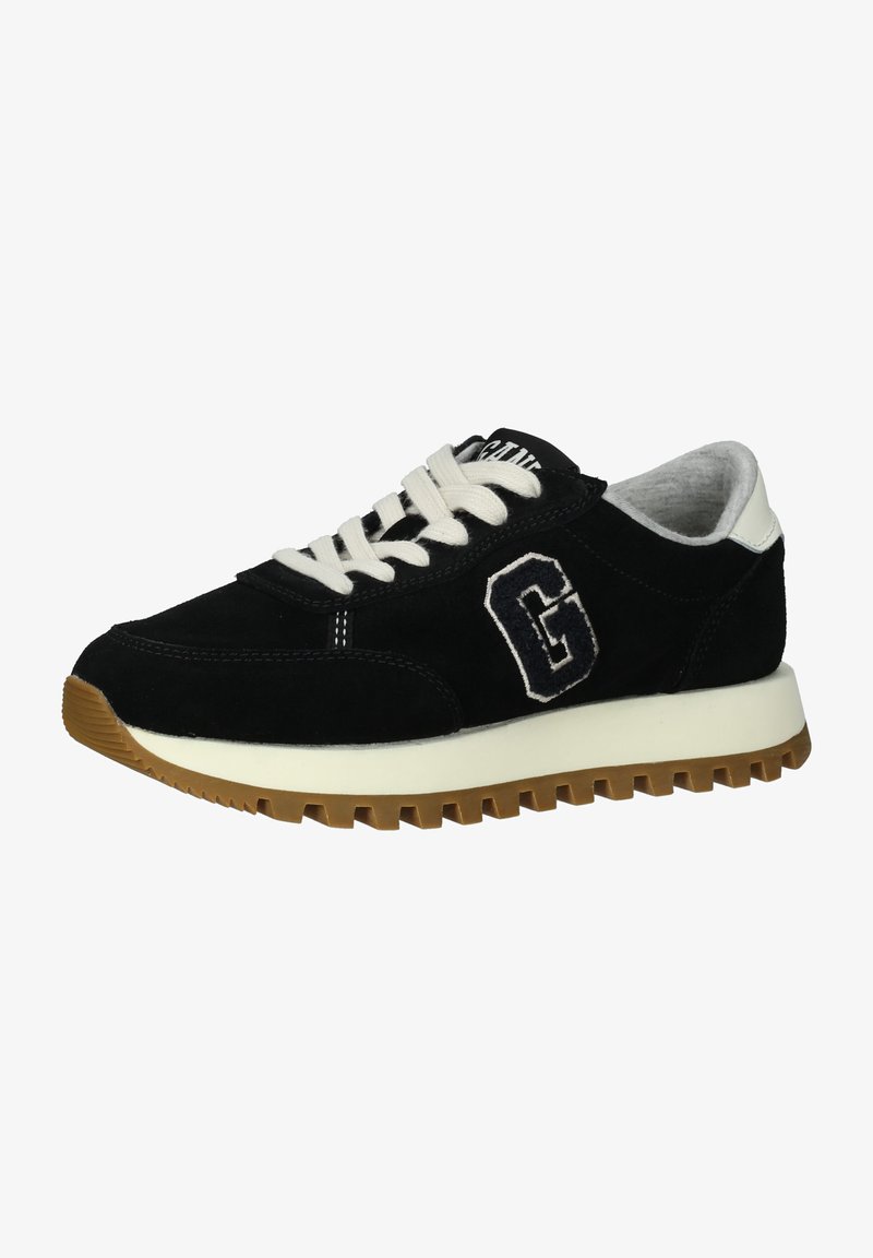 Black suede sneaker with white laces, a raised rubber sole, and an embroidered "G" logo. Features a contrasting beige outsole and padded collar.