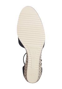 Semelle de chaussure compensée taille 37 avec fond antidérapant crème et partie supérieure en beige tissé visible sur les bords.