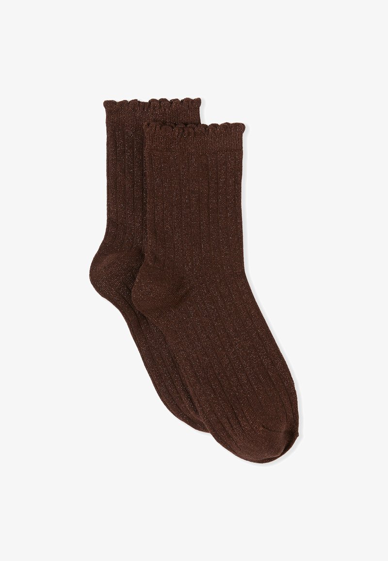 Chaussettes marron côtelées avec un bord festonné, ornées d'une discrète étincelle. Fabriquées dans un matériau doux et extensible pour le confort et l'ajustement.