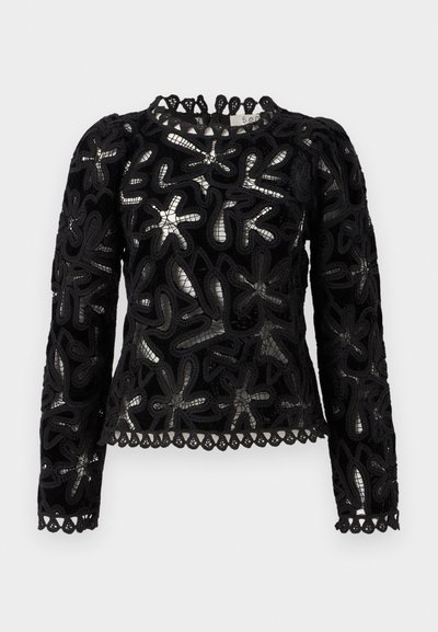 Fekete csipke felső hosszú ujjal, texturált virágmintákkal és fodros szegéllyel. Kerek nyakkivágás részletes élzéssel.