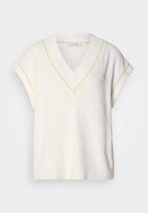 Witte kortarmige trui met V-hals, textuurstof en neongele accentstiksels langs de halslijn en mouwen.