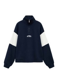Sweatshirt bleu marine avec un panneau blanc sur les manches, col montant et fermeture éclair demi-longueur. Présente un logo en texte à l'avant "SAINT MORITZ."