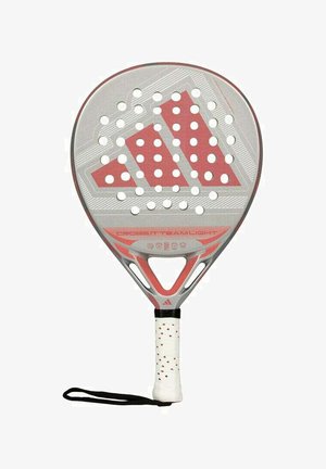 Padel racket featuring a rounded shape, gray and red design, perforated surface, textured grip, and a wrist strap for secure handling.