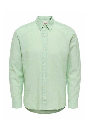 Világoszöld hosszú ujjú gombos ing hegyes gallérral és gombos mandzsettákkal, texturált anyagból készült.