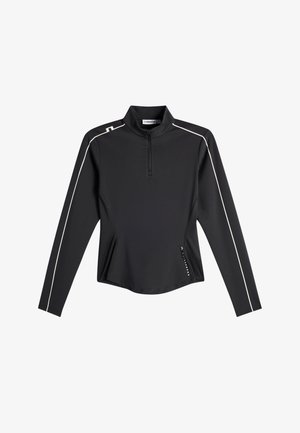 Haut de sport noir à manches longues avec fermeture éclair au quart, passepoil blanc sur les manches et les épaules, et petit texte de logo près de la taille.