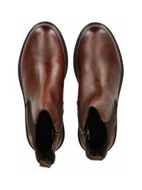 Botas de tobillo de cuero marrón con un acabado suave, paneles laterales elásticos y un sutil detalle de costura. Punta redondeada y suela texturizada.