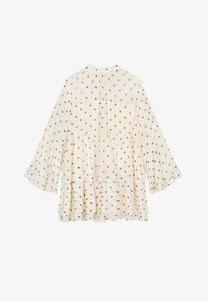 Crème-kleurige blouse met gelaagde tiers, lange klokmouwen en een stippenpatroon in donkerbruin. Lichtgewicht, transparante stof met een ontspannen pasvorm.