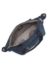 Navy blue fabric bag with a zippered opening, soft handles, and interior pockets. Interior lining is light gray. Features a logo on the side.