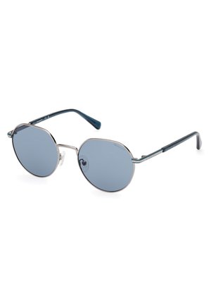 Gafas de sol redondas con lentes grises y un armazón de metal plateado. Las varillas con acento azul oscuro se extienden desde el armazón, con un sutil logotipo.