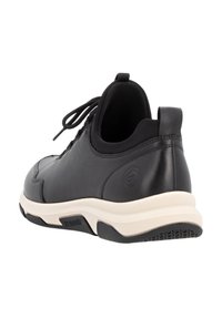 Black leather sneaker with a rounded toe, textured accents, and a cushioned sole. Features laces and a logo on the heel.