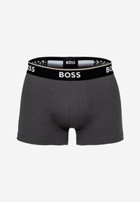 Boxeri gri din bumbac cu un brâu negru pe care este afișat cu mândrie logo-ul "BOSS". Materialul pare neted și elastic.