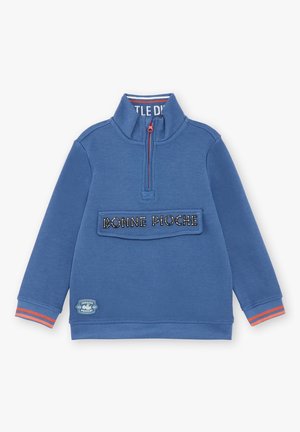 Blauwe lange mouw pullover met half-rits kraag, voorzak met label "BONNE PIOCHE", oranje gestreepte manchetten en een klein patchje met "Jurassic Fossiles".