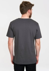 Dark gray short-sleeve T-shirt with a round neckline. Smooth texture, relaxed fit, and a straight hem. No visible logos or patterns.
