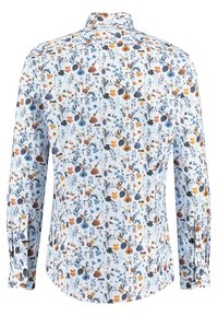 Long-sleeve shirt in light blue fabric featuring intricate floral patterns in orange, navy, and teal. Button-up collar with a rounded hem.
