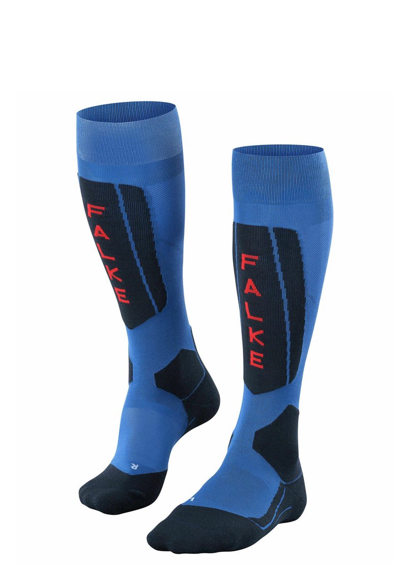 Calze blu al ginocchio con accenti neri, pannelli testurizzati e branding rosso "FALKE". Progettate per comfort e supporto durante l'uso atletico.